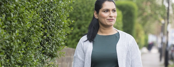 Kidney disease patient walks to her appointment with her
