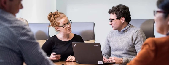 Business man and woman disccusing during a meeting