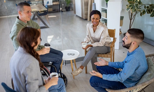 Group of business people sitting and discussing in circle