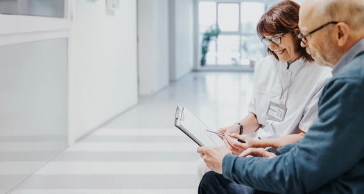 Healthcare professional talking with patient.