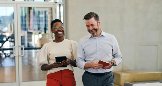 Two business people laughing